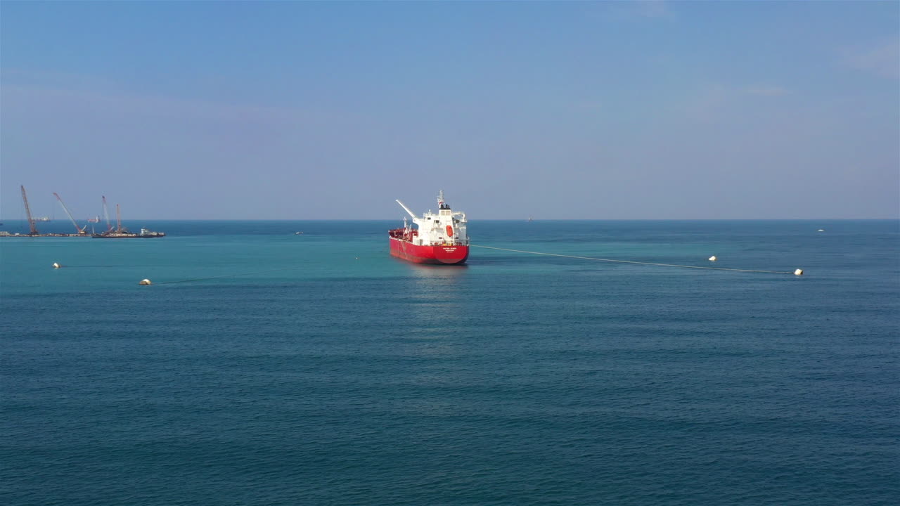 Oil Chemical Tanker Tied with strings Close to port Aerial Footage