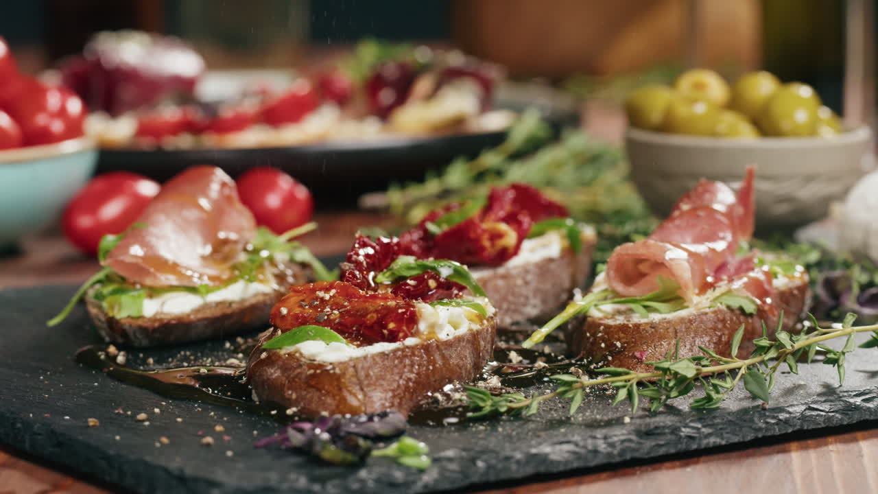 Bruschetta with Prosciutto, Tomatoes, and Cheese