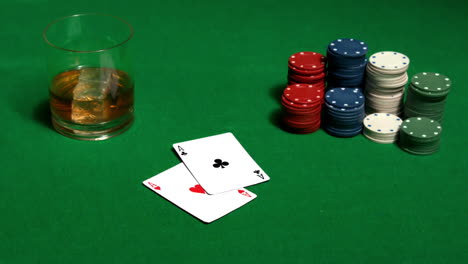 Gambler-putting-his-pair-of-aces-on-table