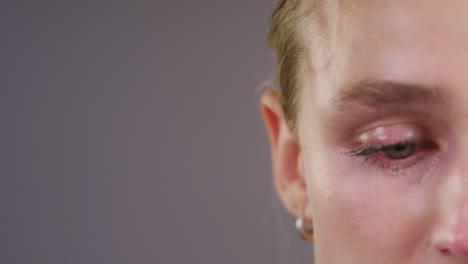 close up of woman with tear rolling down cheek