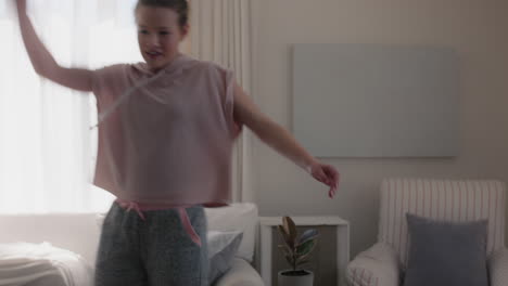 happy-teenage-girl-dancing-at-home-having-fun-celebrating-weekend-with-funny-dance-moves-playful-teen-enjoying-freedom-4k-footage