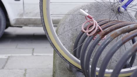 bicycle padlocked to the ground rack