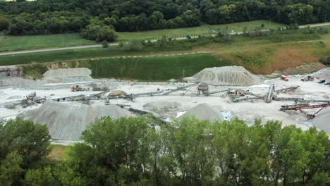 aerial wide shot of industrial limestone quarry with conveyor belt systems