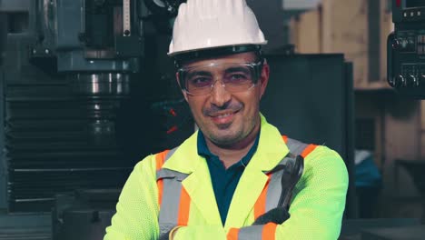 young factory worker or engineer close up portrait in factory