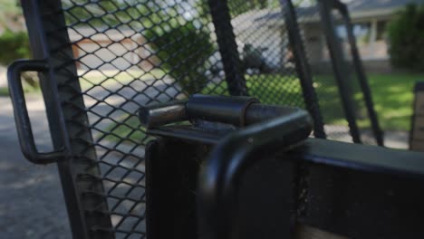 lowering the metal safety gate on a trailer