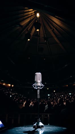 microphone on stage in front of an audience