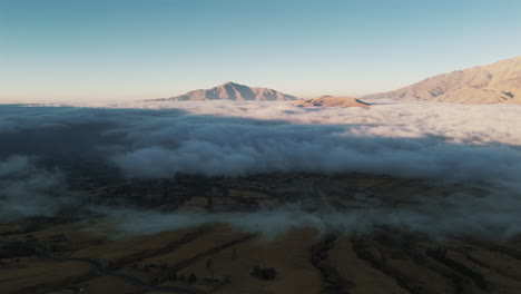 breathtaking drone view of a sunrise above the clouds in tafí del valle, near the andes mountains in tucumán, argentina