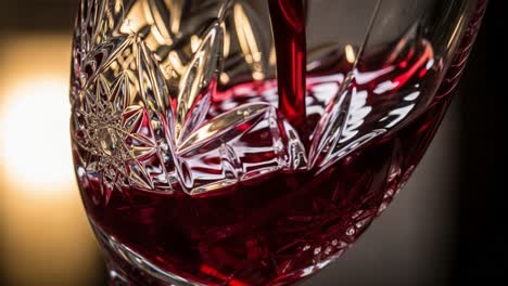 captivating close-up of red wine being poured into an elegant crystal glass, highlighting the sparkling reflections and rich color in a soft background