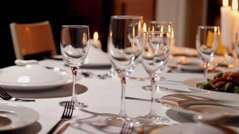 formal dinner table setting with candles