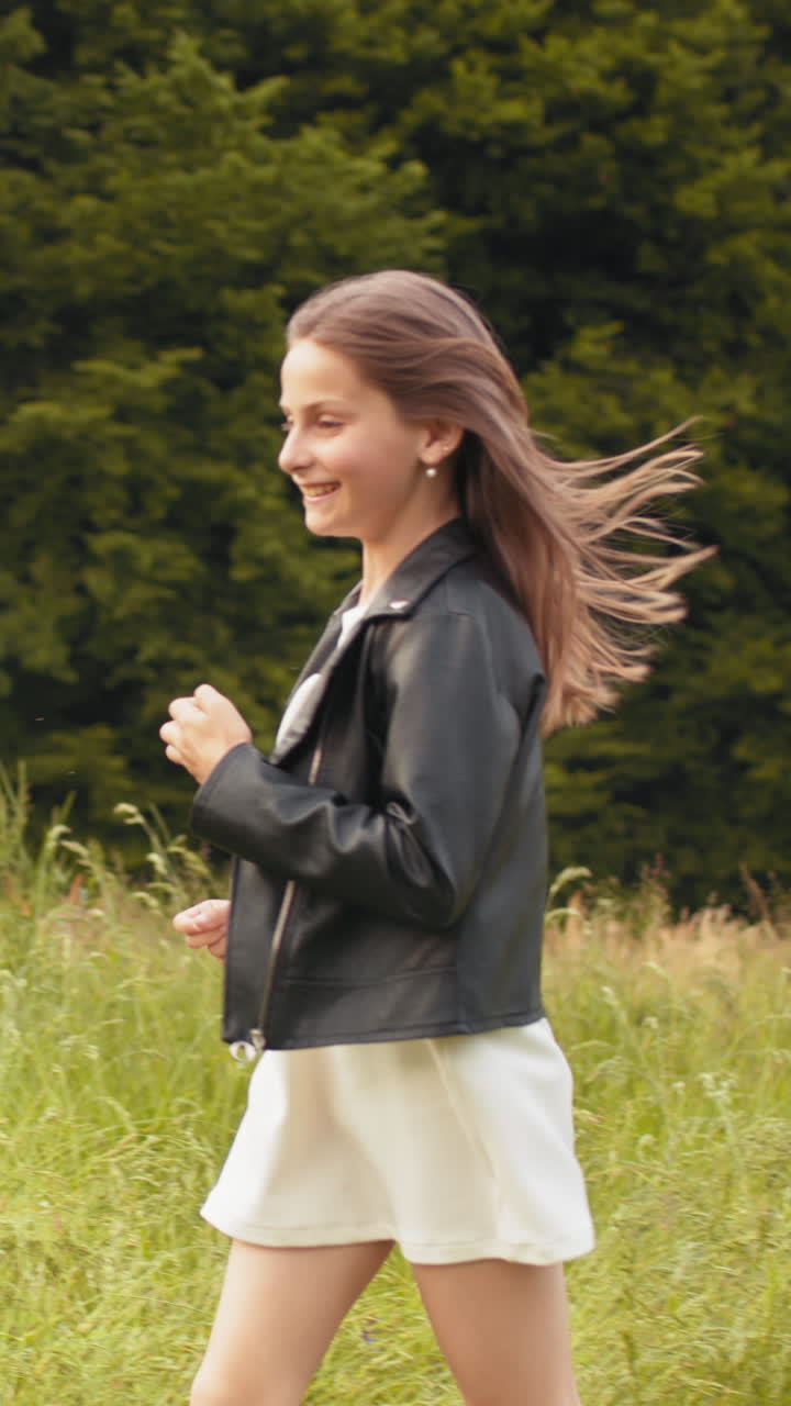 Vertical girls running in field