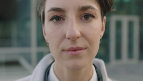 portrait of young confident business woman looking serious at camera close up of successful female corporate professional