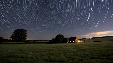 star trails over a country farmhouse