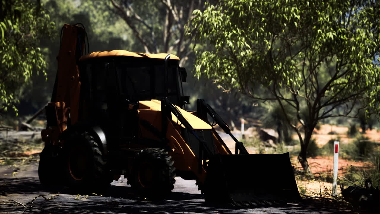 Excavator at work in a sunlit natural landscape with lush greenery