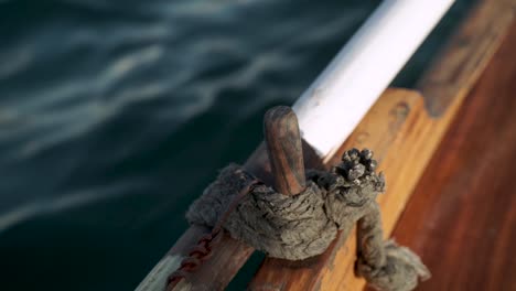 Close-up-of-a-Gondola-oar-lock---boat-moving-in-sea-water-in-Malta