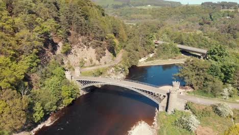 drone shot of craigellachie bridge over the river spey in scotland