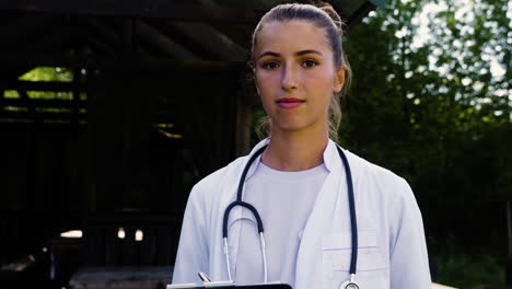 Woman-with-stethoscope-posing-outdoors