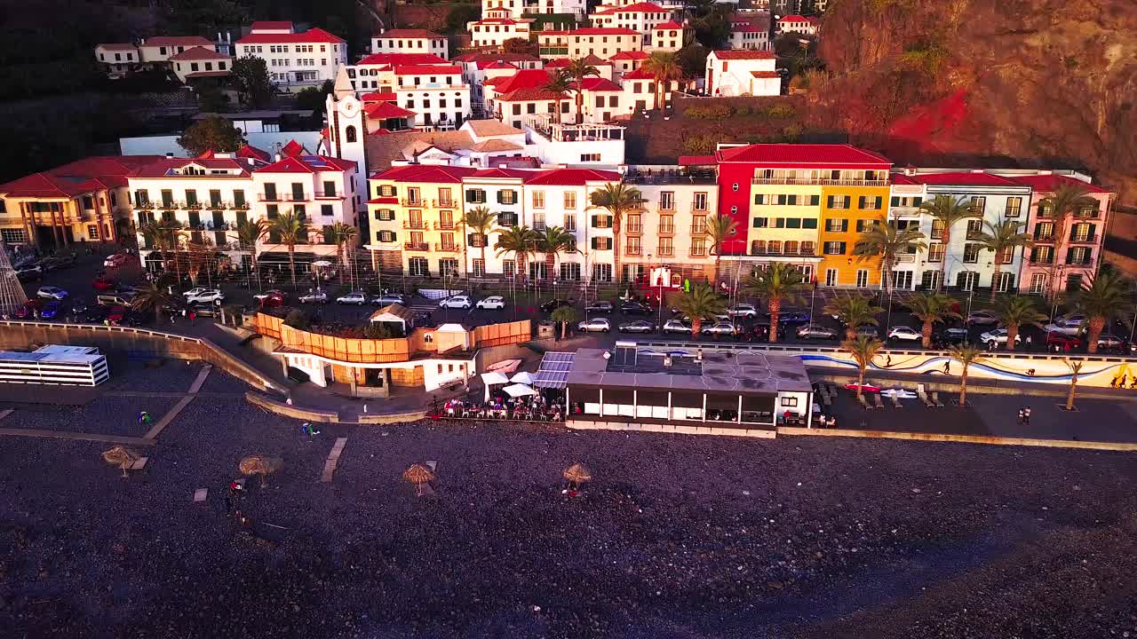 Bright sunset colors over the municipality of Ponta do Sol, Madeira, Portugal - aerial