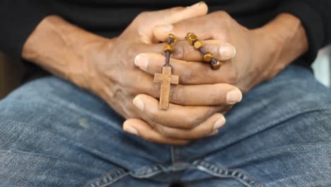 man sitting praying to god in silence with hands together stock video