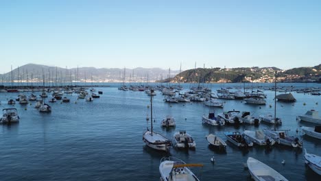 drone flight over boats in the marina of lerici, a small town on the coast of italy near the cinque terre region