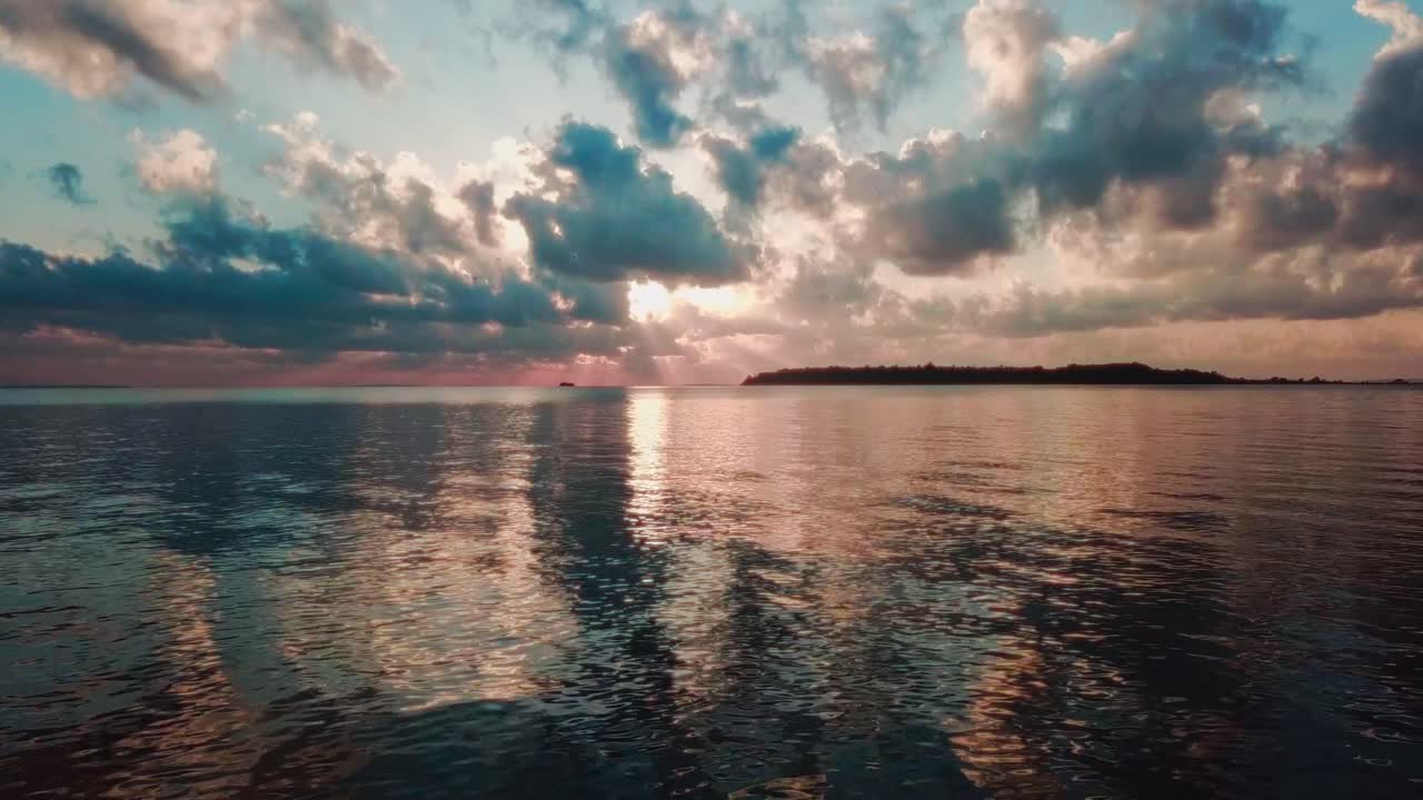 Drone view from near the sea of the sunset of Banda Island, in the Ssese Islands archipelago, in Lake Victoria in Uganda