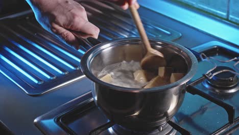 Cooking-Cubed-Cheese-In-A-Small-Pot-With-Water-To-Melt