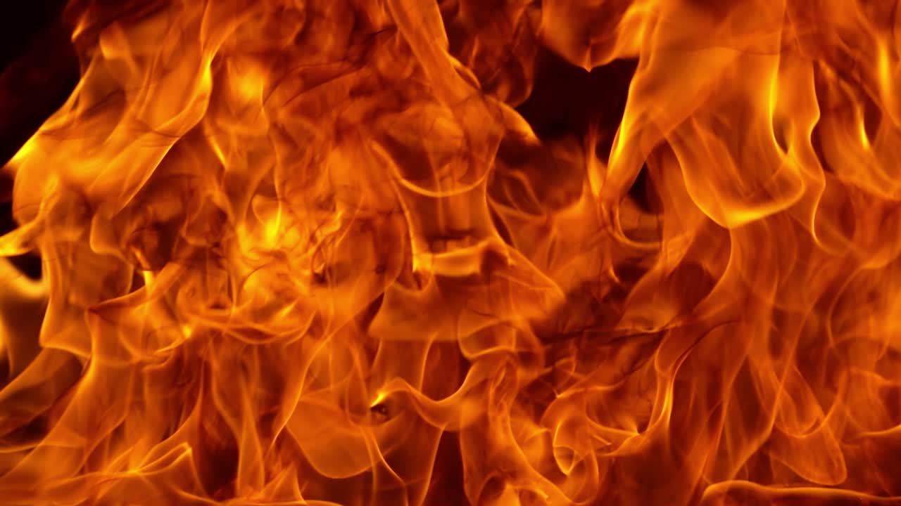 Premium stock video - Flames of fire on black background in slow motion