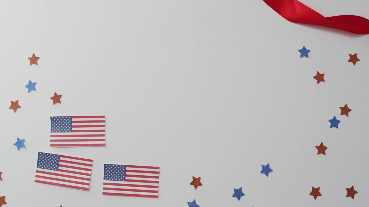 American flags with red and blue stars lying on white background