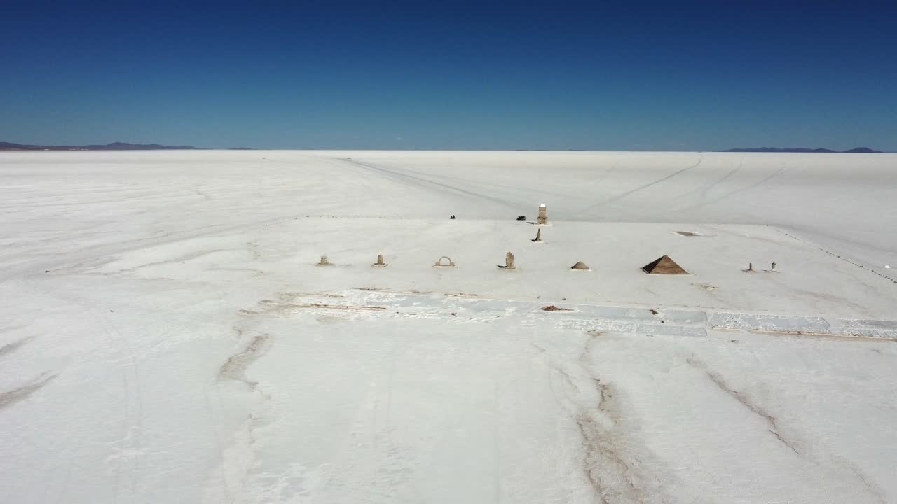 Aerial orbits salt sculpture park on Bolivia's Uyuni Salt Lake Flat