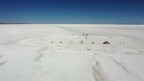 aerial orbits salt sculpture park on bolivia's uyuni salt lake flat