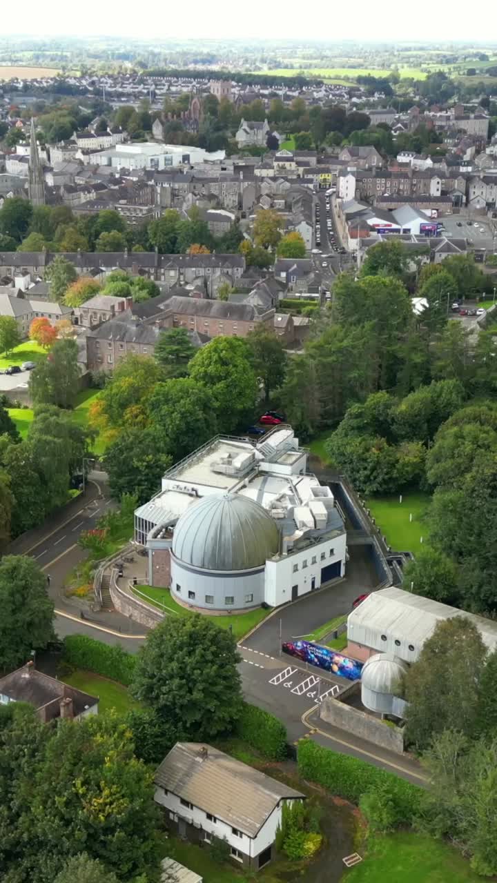 Wide rising social ratio 30FPS aerial of Armagh Planetarium in County Armagh, Northern Ireland. Produced in 1080x1920 with broadcast ready Rec709 color