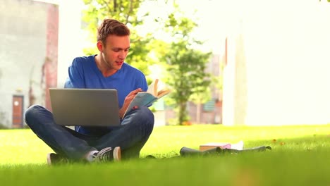 Focused-smiling-student-studying-outside-