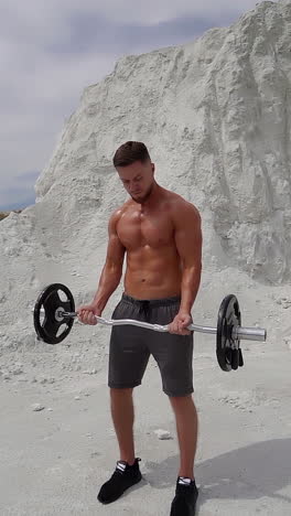 man training outdoor. muscular young man working out on nature vertical video