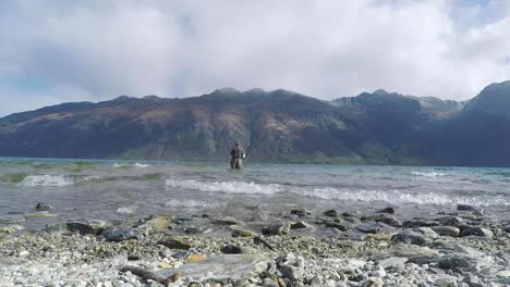 man fishing in lake