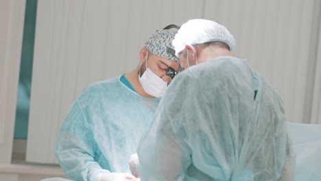 surgeons performing a surgical procedure