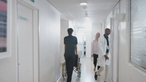 busy hospital corridor with medical staff and patients