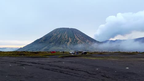 amazing view of bromo tengger semeru national park with mountain that emit smoke