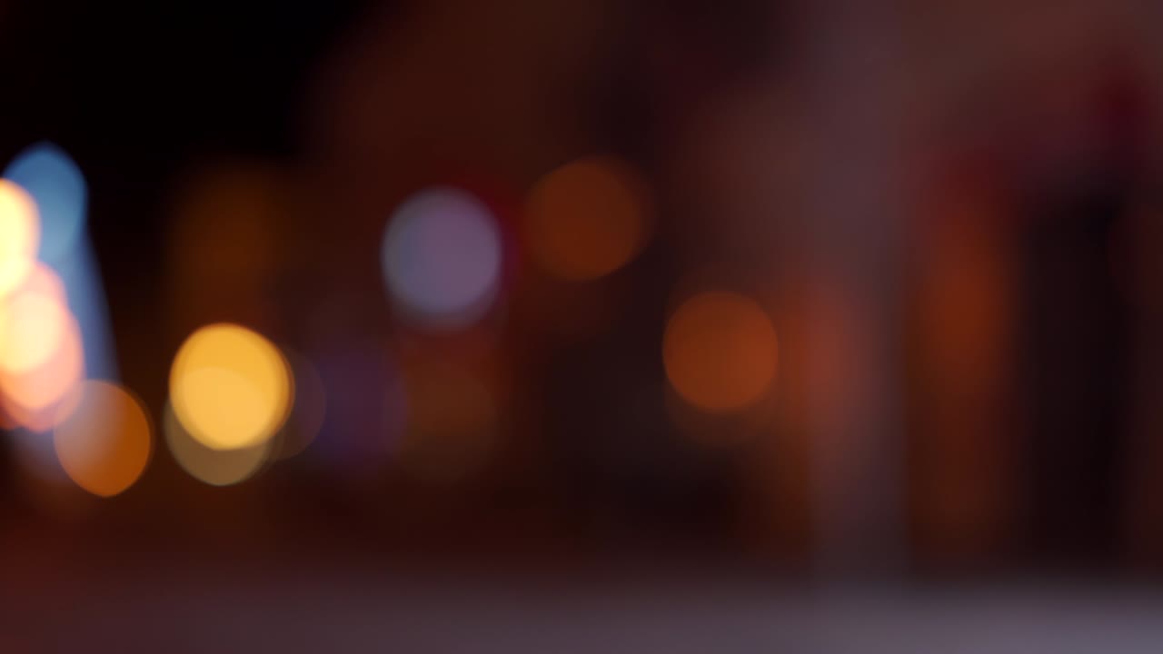 Illumination on street at night, defocused bokeh city lights.