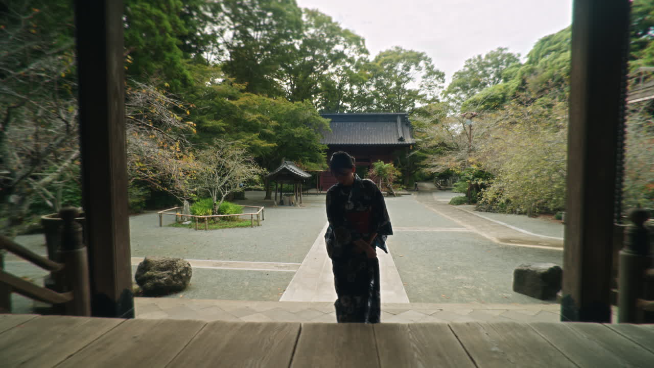 Woman in Kimono at a Traditional Japanese Temple