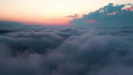 flying over the clouds with the late sun. sunrise or sunset colorful sky background.