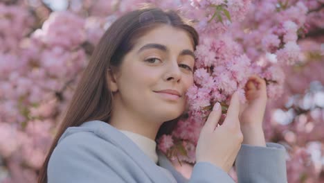 woman enjoying cherry blossoms