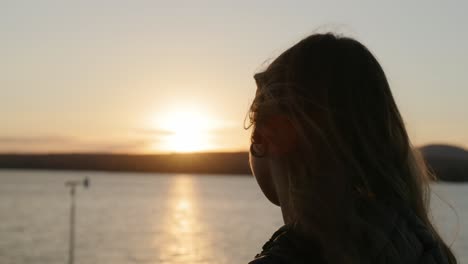 Pretty-Young-Girl-Enjoying-The-Sunset-View-At-The-Beach-In-Magog,-Quebec,-Canada