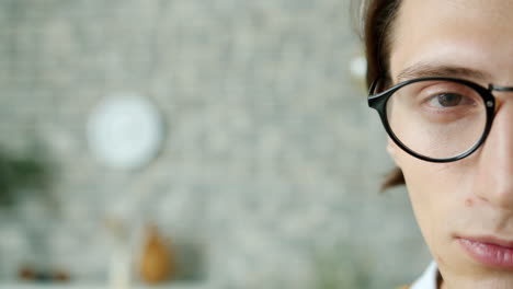 close-up of a man wearing glasses