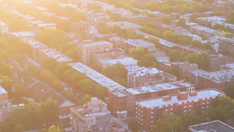 aerial view of a densely populated city neighborhood at sunset