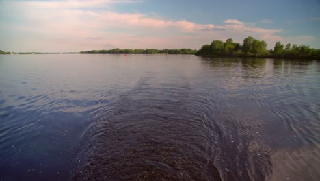 circles on water after boats floating