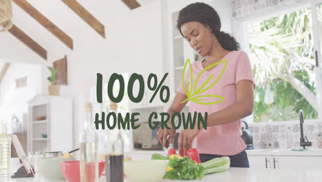 animation of 100 percent home grown text over african american woman preparing veggies in kitchen