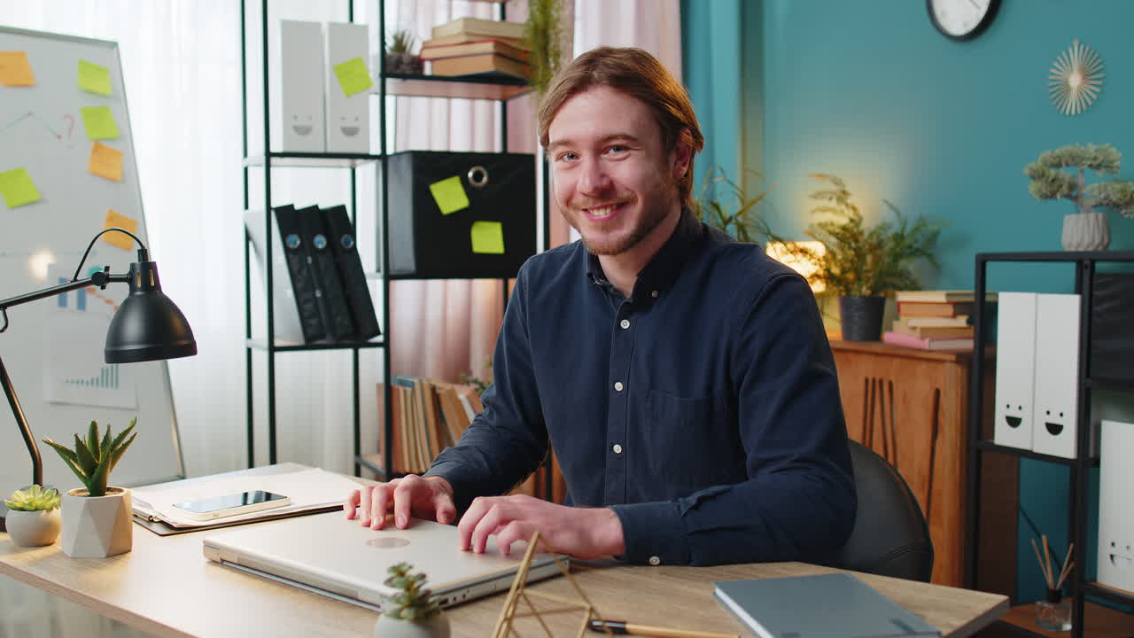 Businessman guy closing laptop computer after finishing work browsing internet at home office