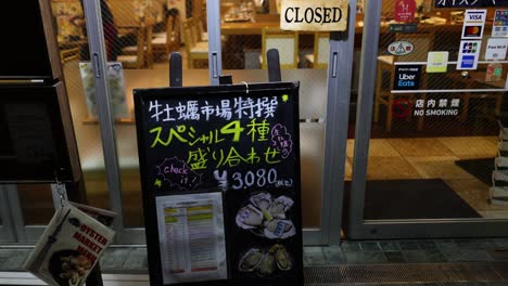 restaurant door sign changes from open to closed