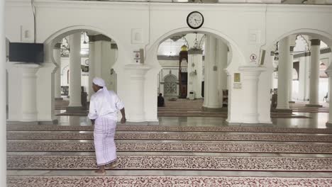 muslim man sit in the the kapitan keling mosque for the prayer