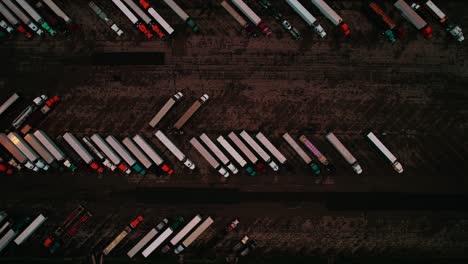 many trucks parked at truck stop at night, wisconsin, aerial view