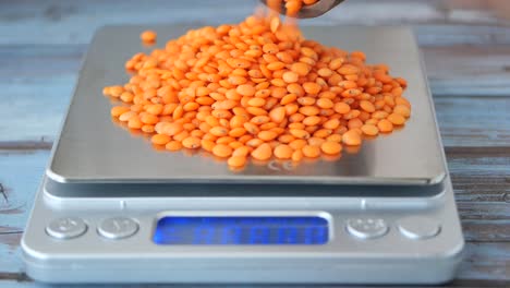 red lentils on a kitchen scale
